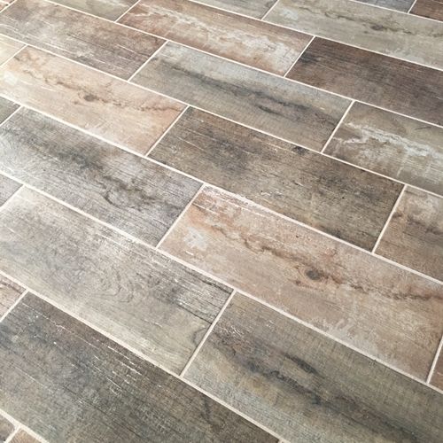 The wood-look porcelain tile Alex installed is bea