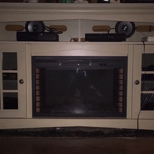 He assembled an electric fireplace/entertainment s