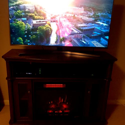 Jim and Mike picked up a big TV stand fireplace fo