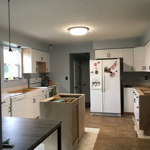 Installed pre-assembled kitchen cabinets.  Was ver