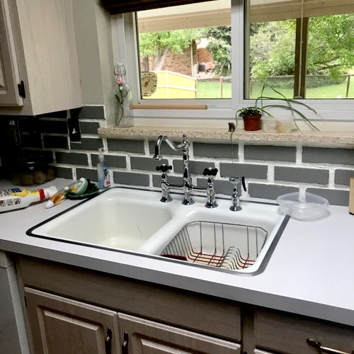 Kevin was able to install our new kitchen sink on 