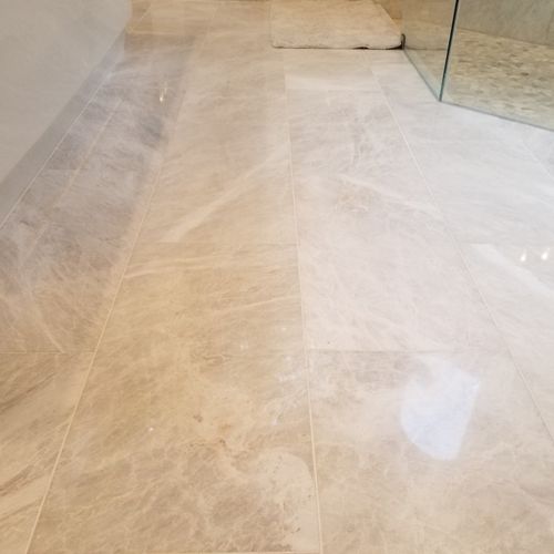 Our marble bathroom floors were covered in scratch