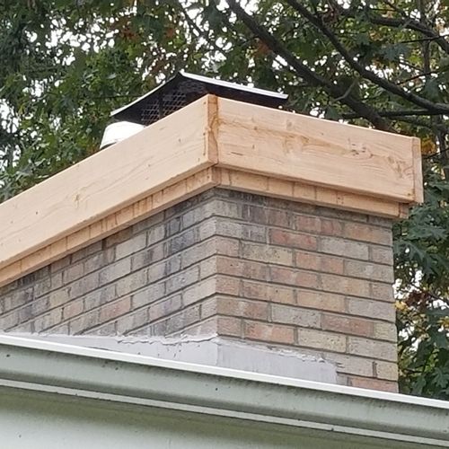 The lumber is around the new cap while the cement 