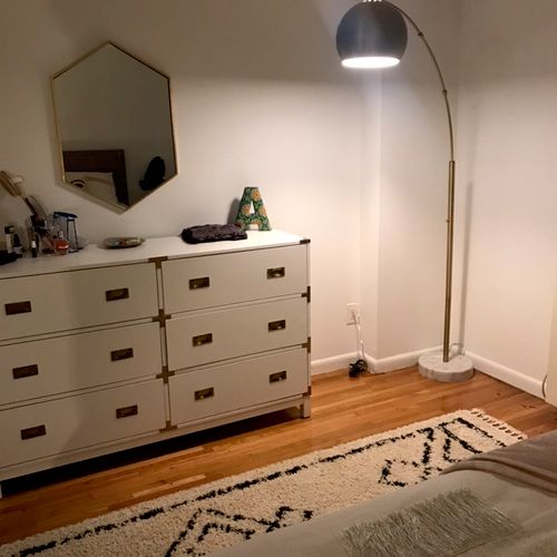 He assembled a floor lamp and mounted a mirror for