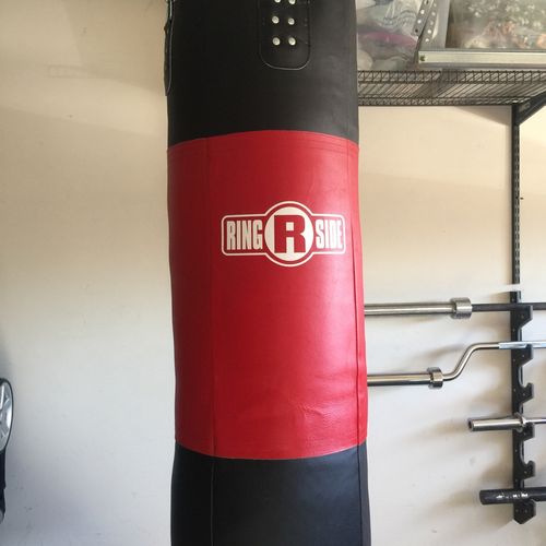 Larry safely hung a 200lb heavy bag in my garage g