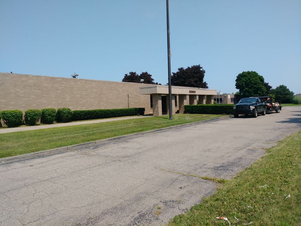 Shrubs, neglected vacant facility