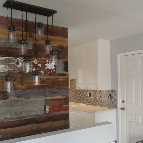 Custom wall framing with reclaimed barnwood accent