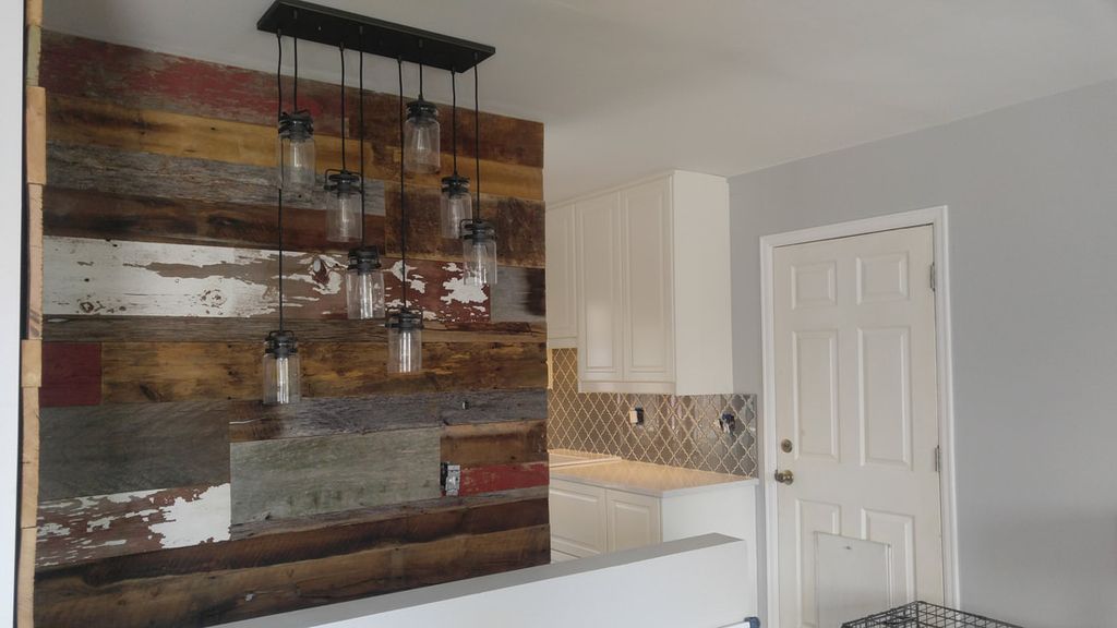 Custom wall framing with reclaimed barnwood accent