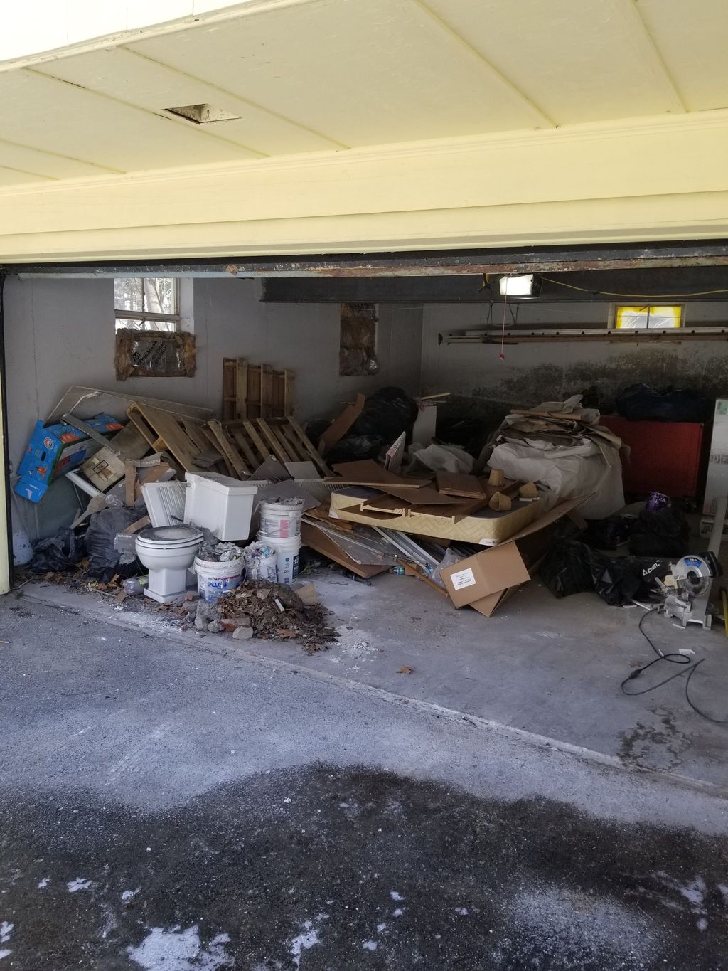 Before photo of a garage Cleanout , trash material