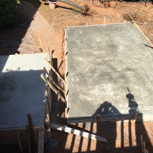 We needed two concrete pads on a sloped area for a