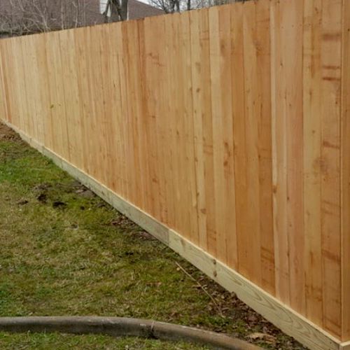 6’ picket fence with 6” rock board on bottom 