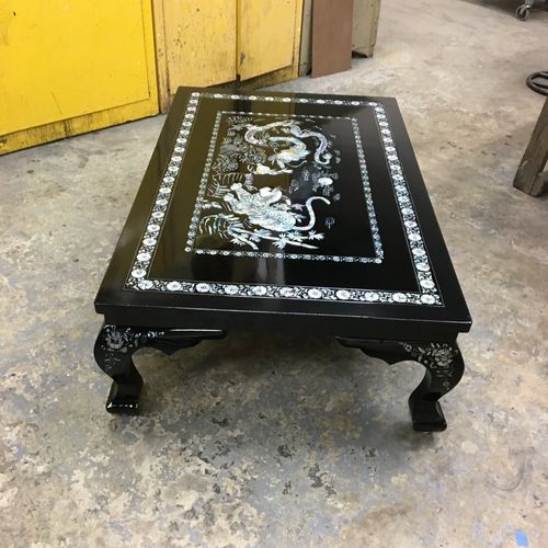 He repaired a Black Lacquered with mother of pearl