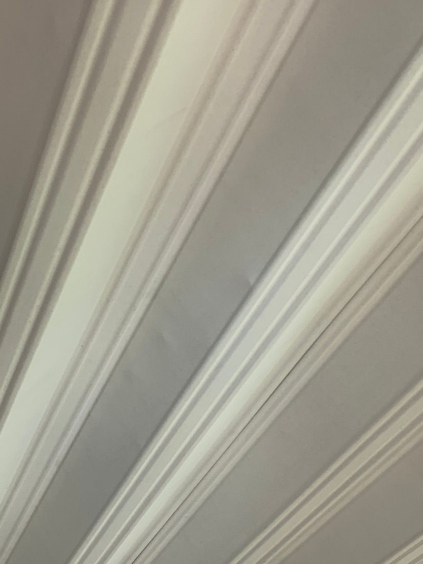 Hail dents on metal roofing, view from bottom