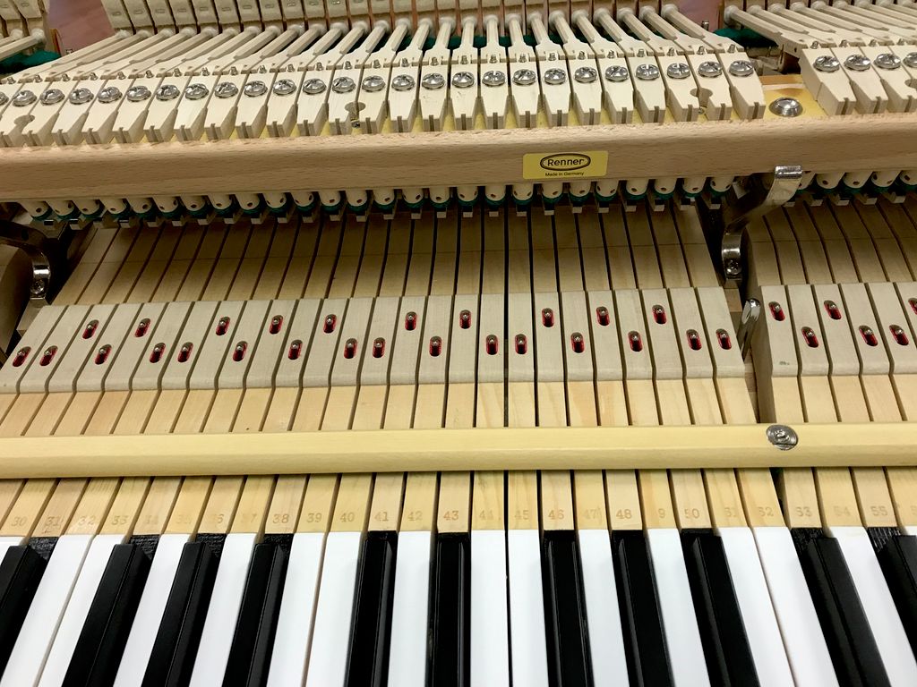 Restored grand piano action with German Renner par