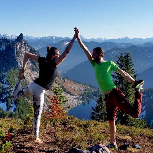 Dancers pose on a mountain