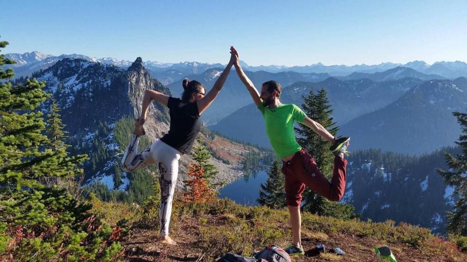 Dancers pose on a mountain