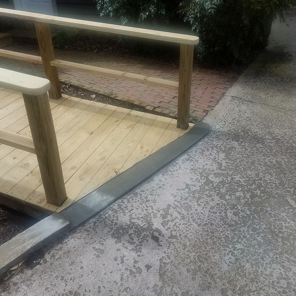 Cement transition from ramp to driveway.