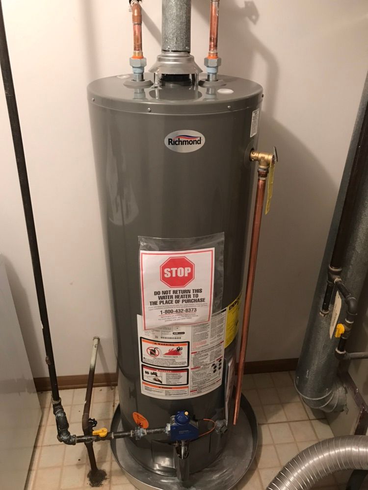 Soldering copper fitting for new water heater.