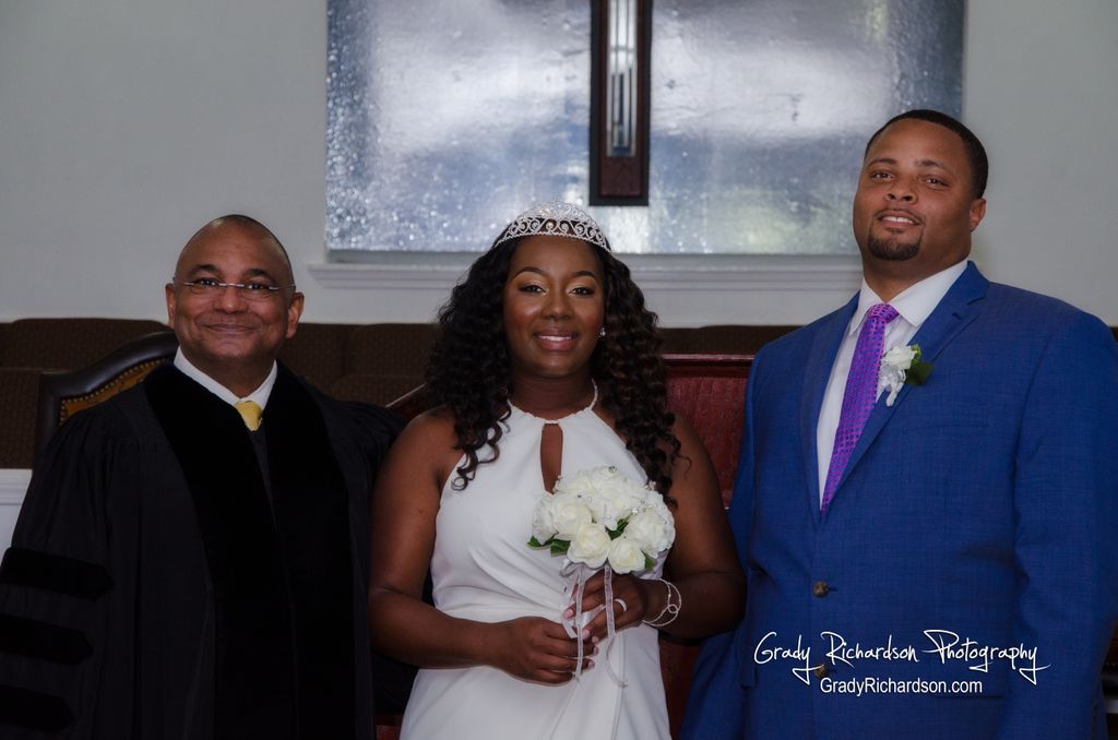 Pastor, Bride, and Groom