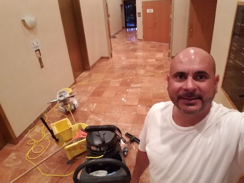 polishing marble floor at Raymond James bldg in Cl