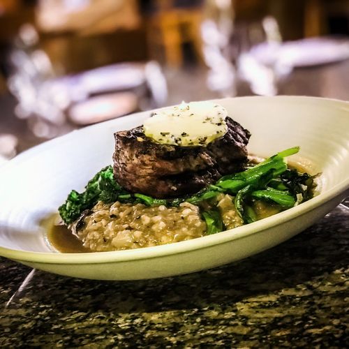 Grilled filet over a wild mushroom risotto and gar