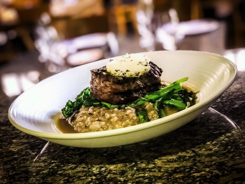 Grilled filet over a wild mushroom risotto and gar