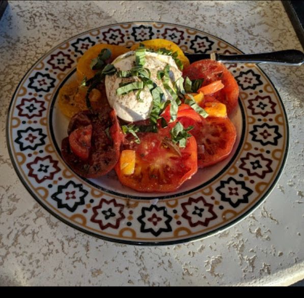 Caprese salad with fresh heirloom tomatoes, fresh 