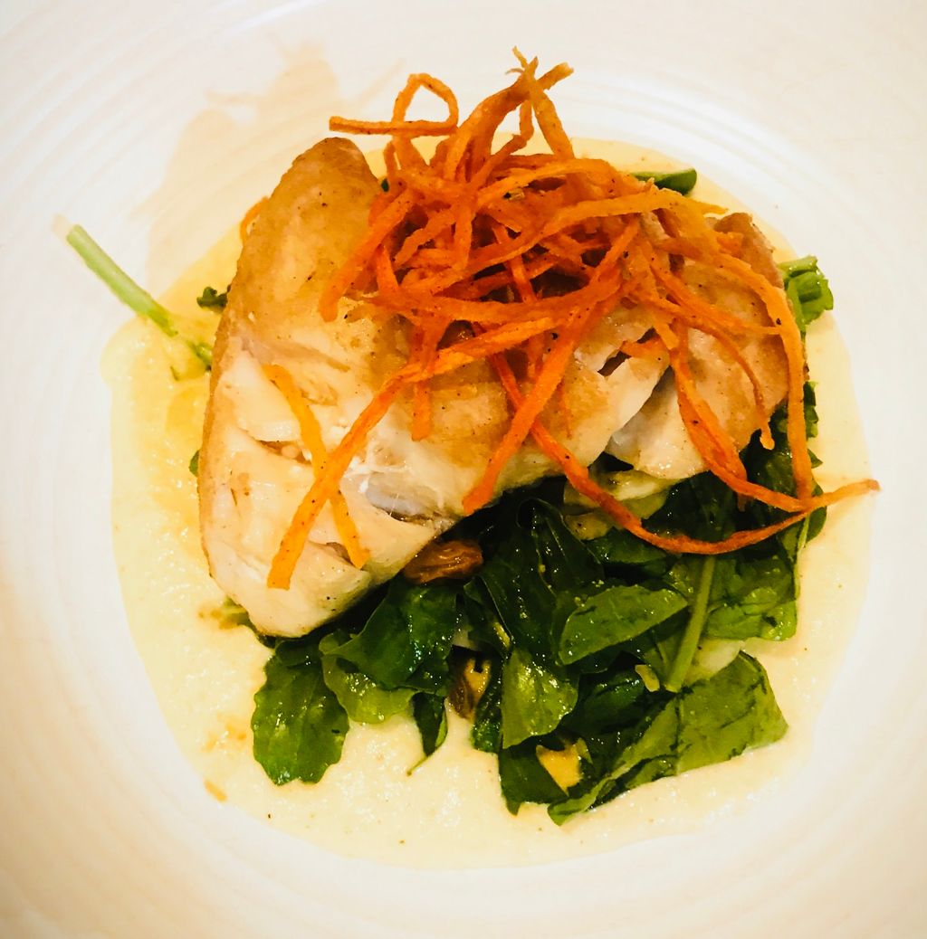 Pan seared grouper, over a bed of sautéed spinach 