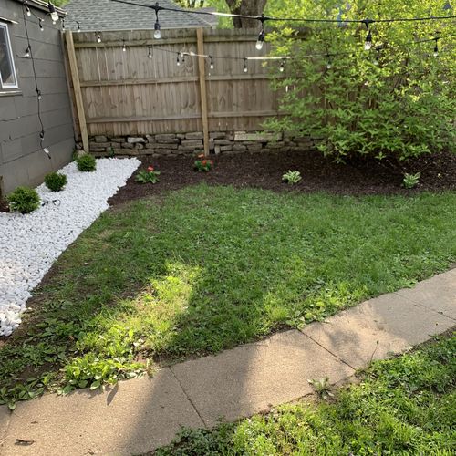 Planted boxwoods, hostas, and daisies. Installed w