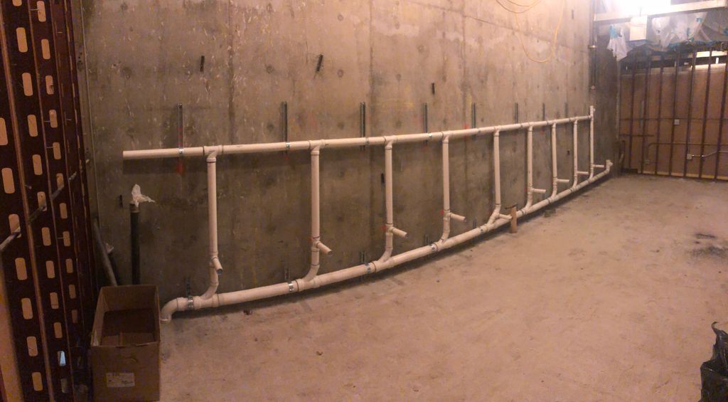 Rough plumbing for urinals and sinks public restro
