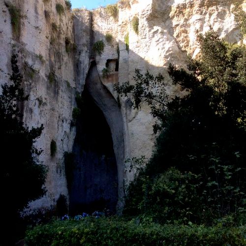 Ear of Dionysius, a limestone cave carved out of t