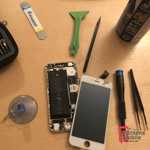 iPhone repair setup with tools. We fix all cracked