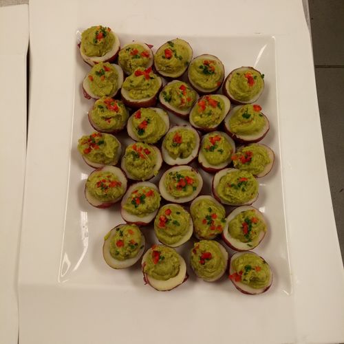 Red skinned potatoes filled with guacamole