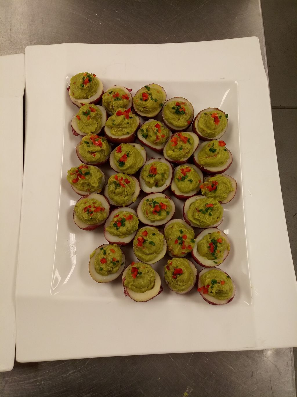 Red skinned potatoes filled with guacamole
