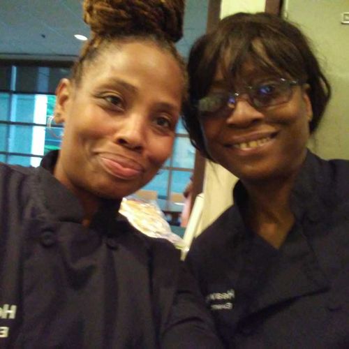 The partners at a catering event