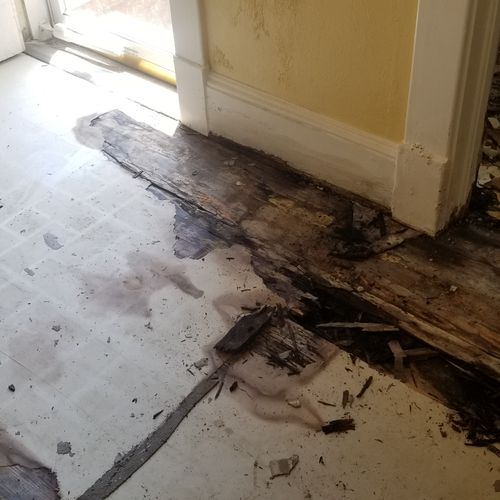 Before picture of water damaged floor, floor joist