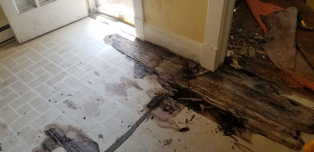 Before picture of water damaged floor, floor joist