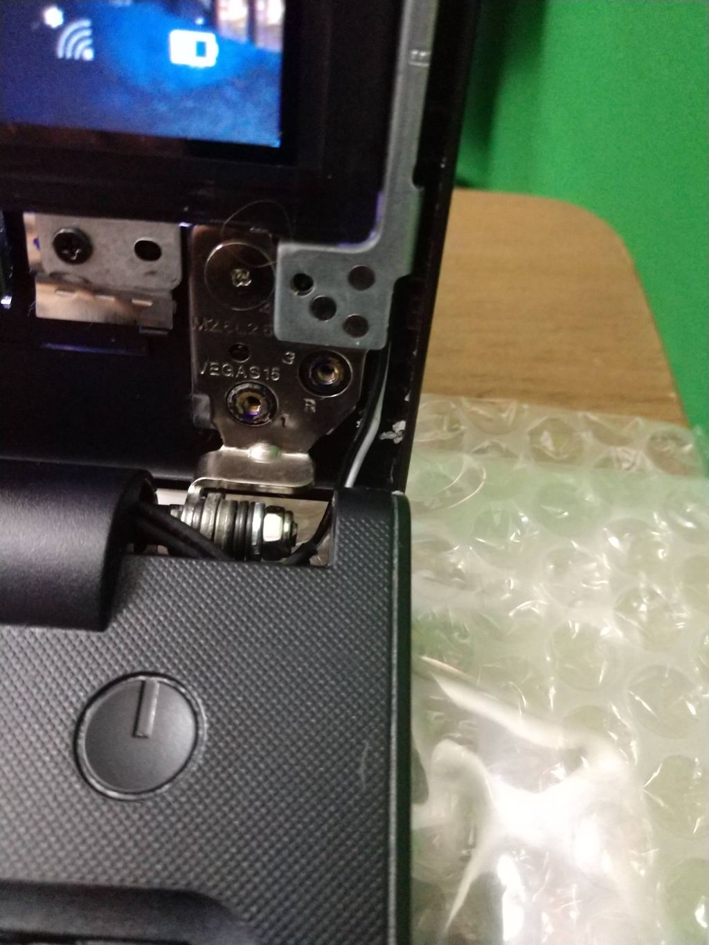 Broken hinge and back cover