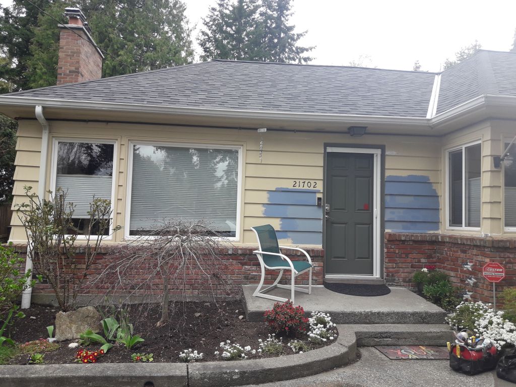 before (green door, no window trim)