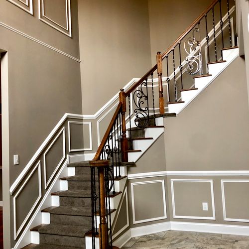  Custom wrought iron stair case with upgraded trim