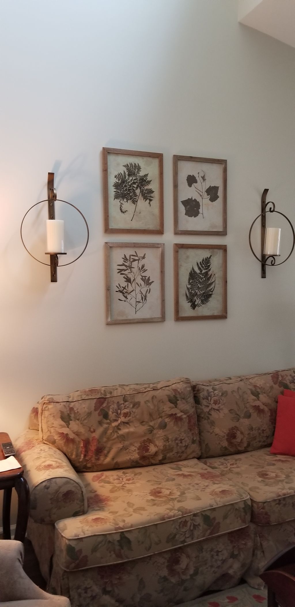 collage centered on living room wall