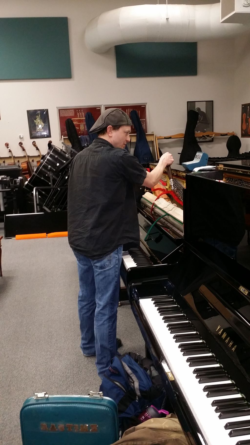 Making sure the pianos are ready to sell!