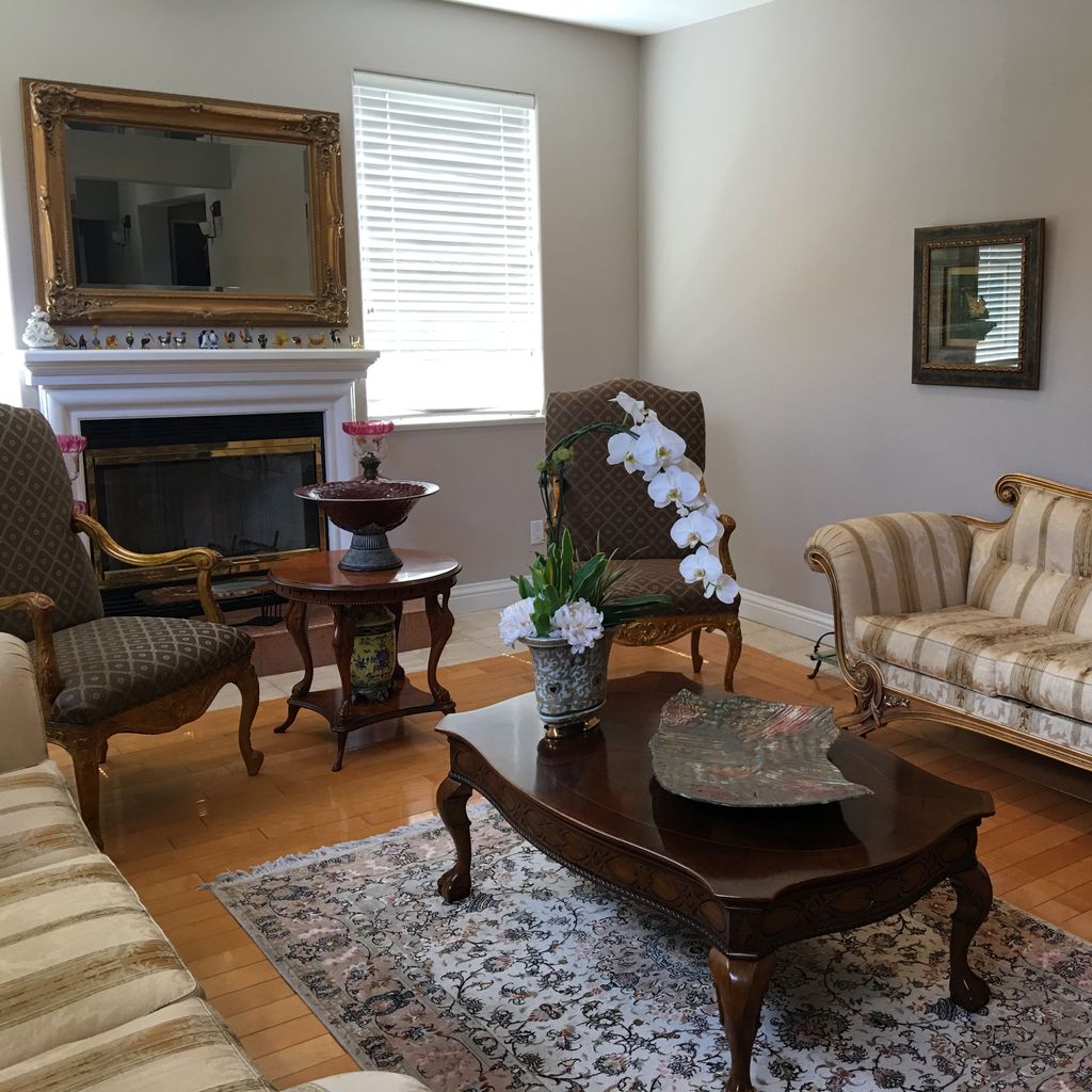 Living Room With Coffee Table, Grey Couch, Black Rug, And Table Ideas