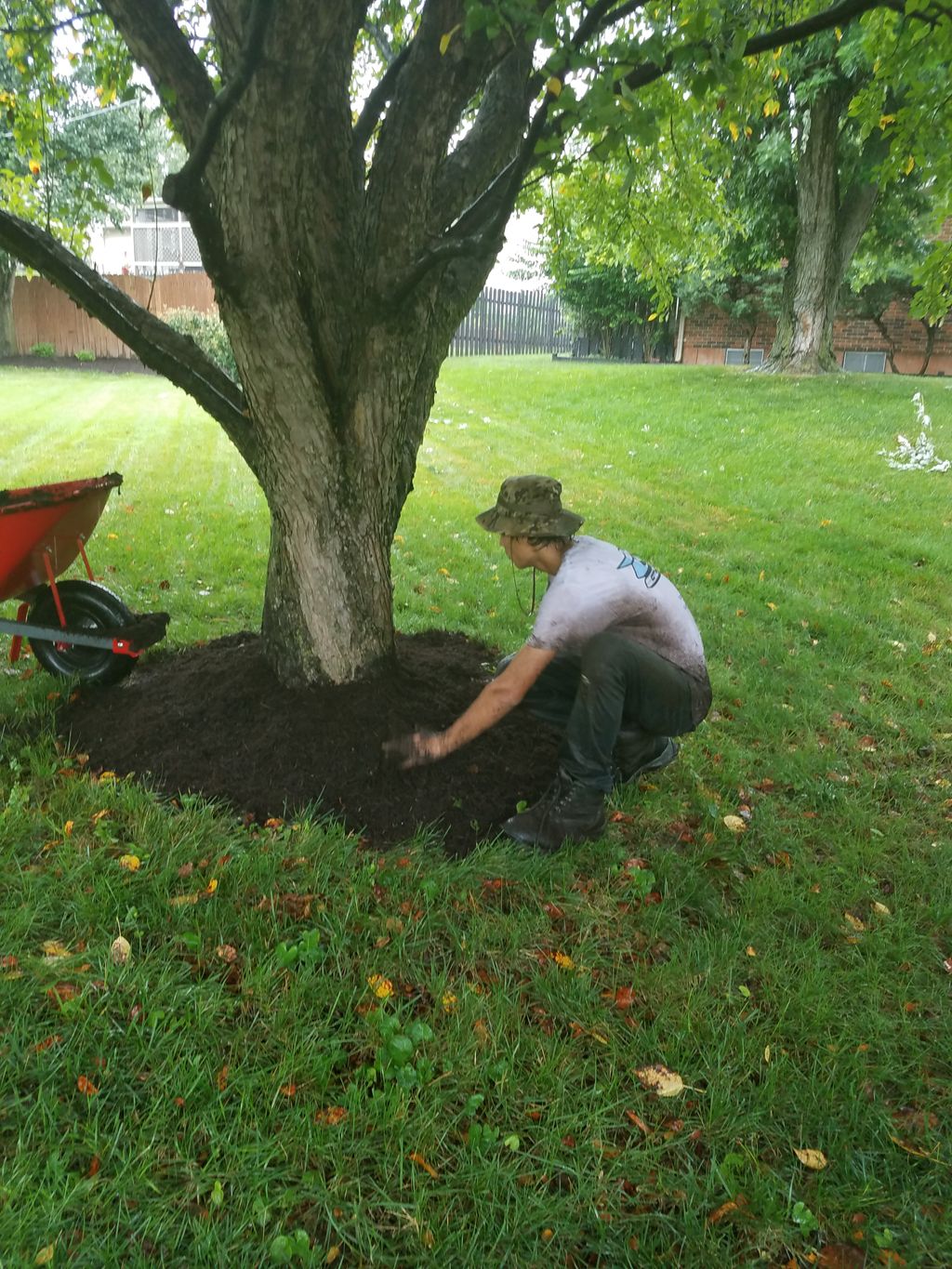 Mulching in the rain - because we are committed to