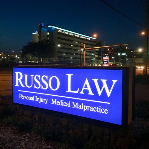Russo Law Sign at Night