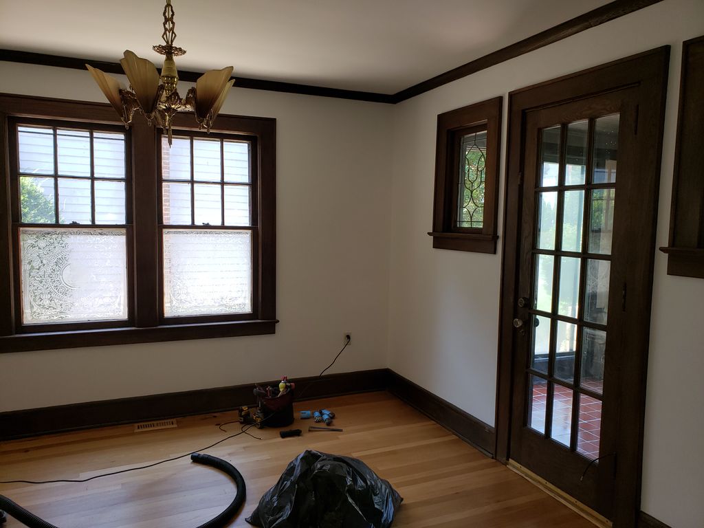 Repaired old wood windows with ropes/chains 