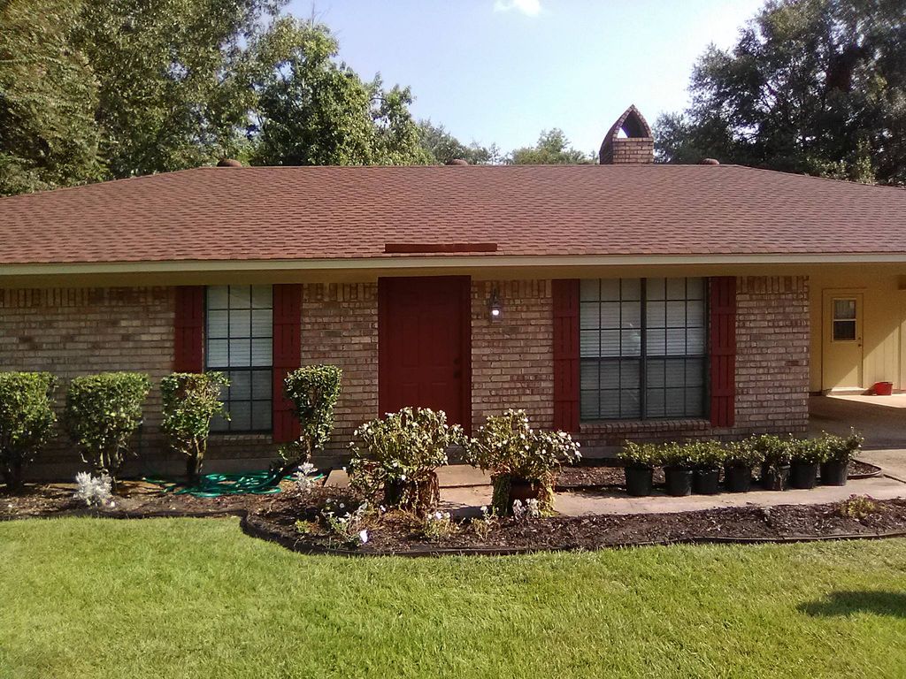 painted exterior of house and stained shutters