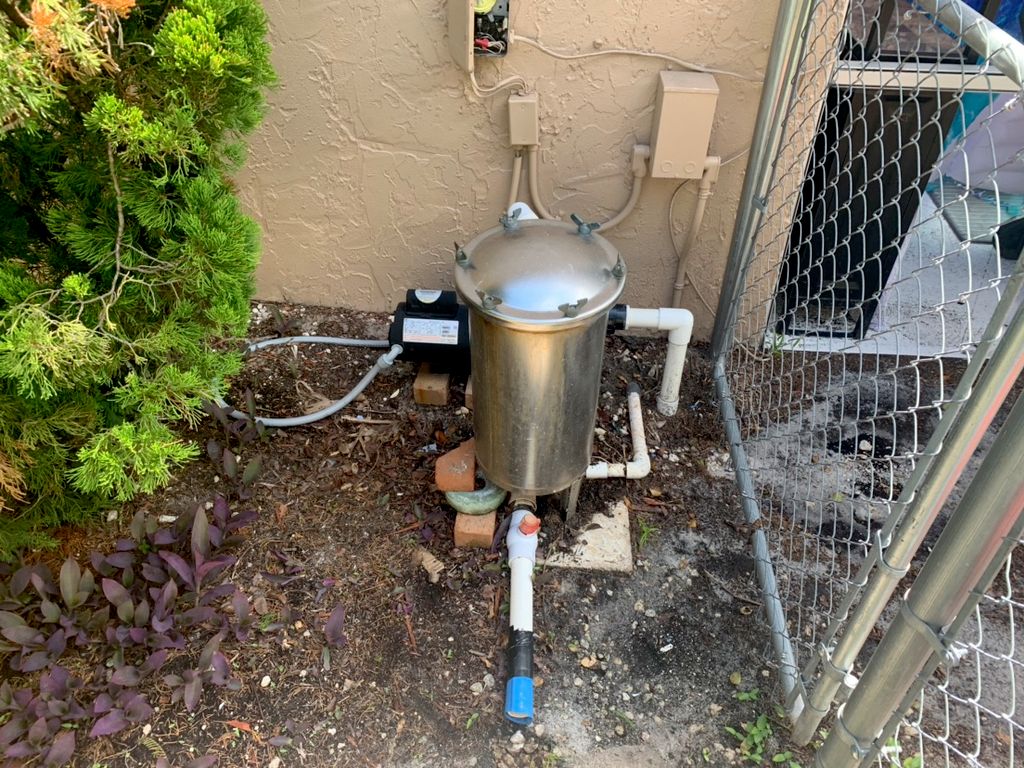 Before- Pool equipment installed on loose bricks