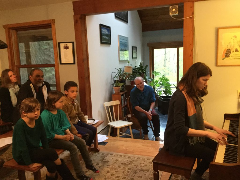 Evie performs at the piano party