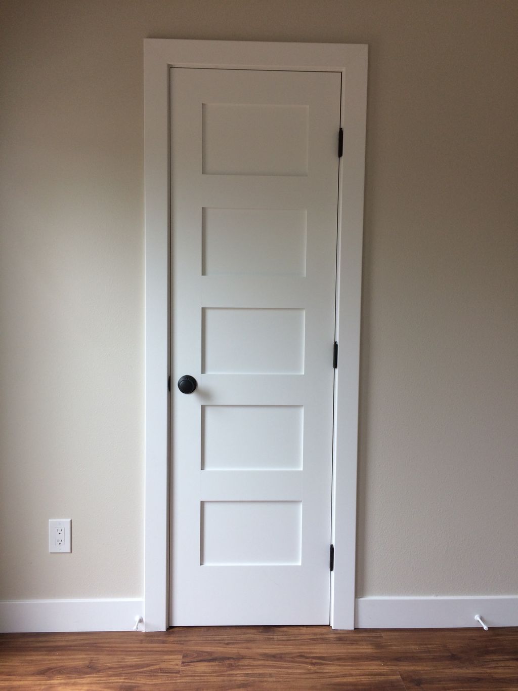 Shaker style door, install with spray finish.